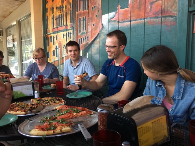 REU students eating pizza